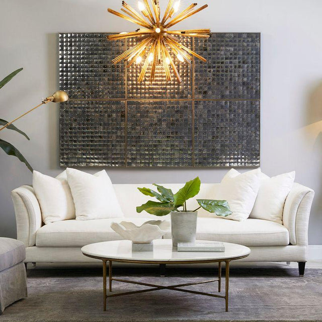 a luxury living room with a styled coffee table and white sofa