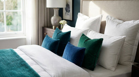 Soft pillows for a hotel-style teal or jewel-tone bedroom