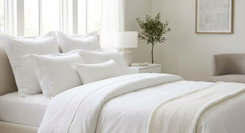 King size pillows for a white, hotel-style bedroom
